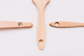 Isolated wooden paint brushes for painting on white canvas.