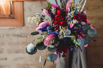 Bouquet of dried autumnal flowers with purple colors ideal for a wedding.