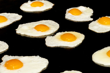 Fried and scrambled eggs and omelette station in a hotel or restaurant setting, catering breakfast