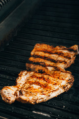 cooking steaks on grill 