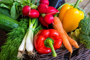 Home delivery fresh vegetables in box on a vintage wood background. The concept of healthy food.