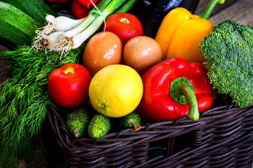 Home delivery fresh vegetables in box on a vintage wood background. The concept of healthy food.