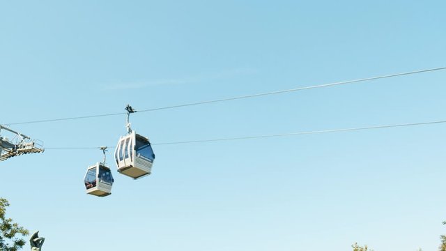 Montjuic cable car in Barcelona on a background of blue sky
