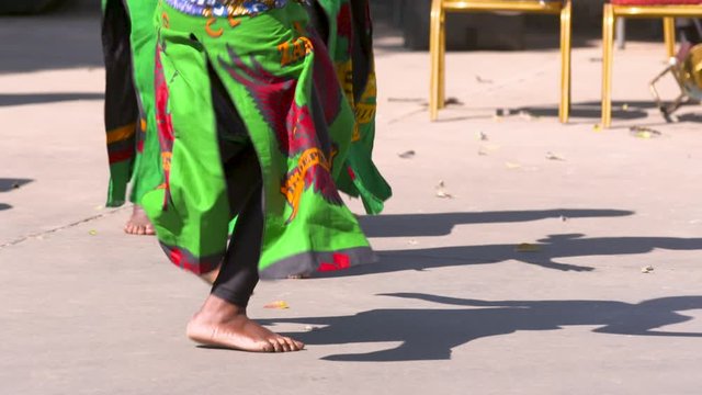 African dancer's feet dancing in traditional costumes in Zambia