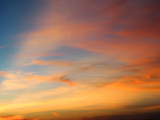 Naklejka na ściany i meble Clouds in the evening sun light
