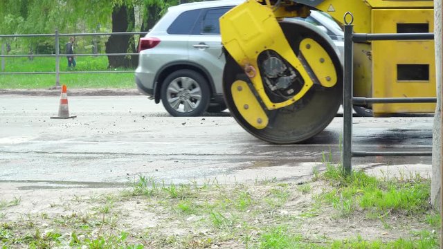 Road roller working on asphalt pavement installation
