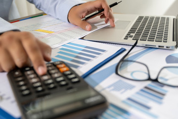 businessman work in office analysis chart graphy planning analyzing financial document data charts using calculator strategy analysis financial