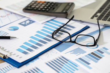 Naklejka na ściany i meble businessman work in office analysis chart graphy planning analyzing financial document data charts using calculator strategy analysis financial