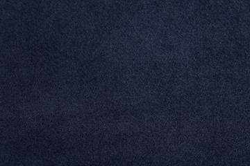 Texture of dark blue fabric as background, closeup