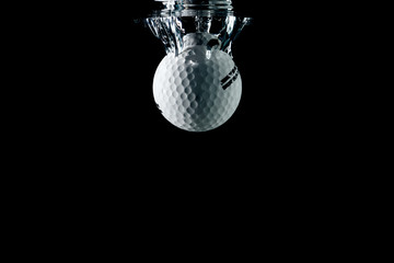 golf ball entering the water and splashing