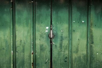 Old rusty metal green door texture background