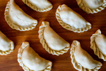 Curry puffs arranged in pattern and ready for oven