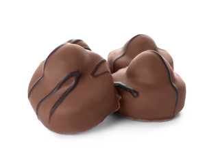 Delicious milk chocolate candies isolated on white