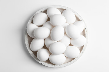 Fresh chicken eggs on white background, top view