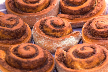 homemade sinabon buns with sugar and cinnamon baked in the home kitchen as an example of home baking