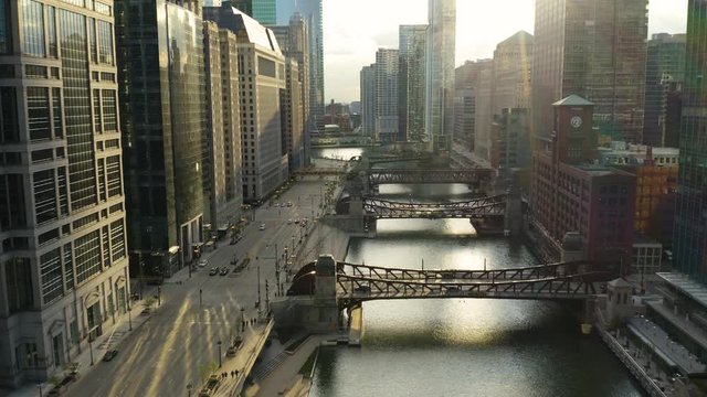 Cars Drive on Upper Wacker Drive along Chicago River during COVID-19 Stay at Home Order, Pull Back, Aerial Over Road