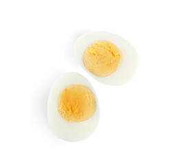 Halves of fresh hard boiled chicken egg isolated on white, top view