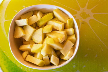 From above a bowl with delicious fresh cut apples