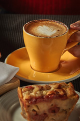 female hands holding cups coffee