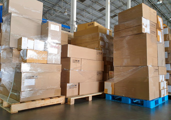 Interior of warehouse storage, stack of package boxes on pallets, warehouse industry delivery shipment goods, logistics, transport