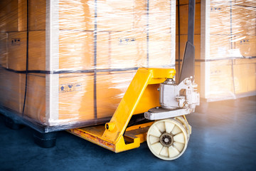 hand pallet truck or hand forklift with large pallet shipment goods. cargo shipping export and logistics