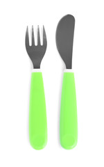 Cutlery with plastic handles isolated on white, top view. Serving baby food