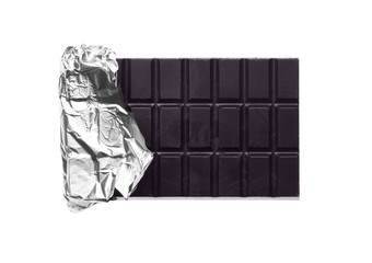 Delicious dark chocolate bar wrapped in foil isolated on white