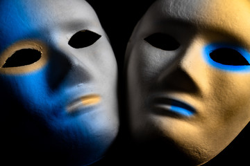 white anonymous face masks painted in colors