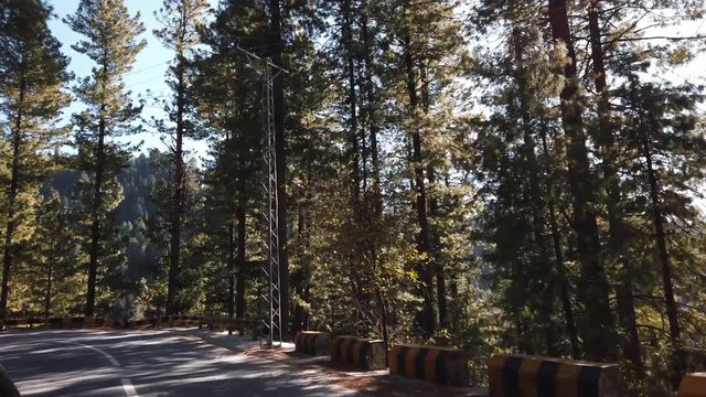 The Shot was taken on the way to the famous tourist location called Natahi Gali.The shot Highlights the Van or know as in Pakistan "Carry Duba"passing through the beautiful roads of Abbottabad