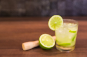 Defocused photo of Brazilian caipirinha, traditional Brazilian drink for use as a background.
