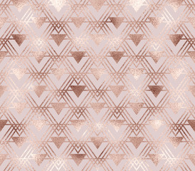 Elegant rose gold geometric seamless pattern with triangle tiles in art deco style.