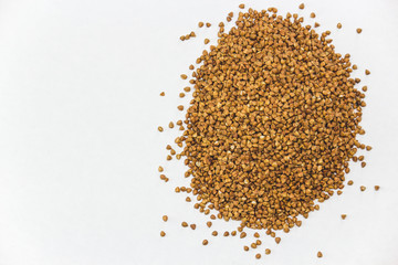 Buckwheat seeds closeup isolated on white background copy space