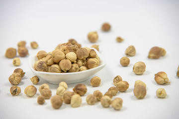 Best cardamom, Siam Cardamom or Kapulaga on white canvas background. Camphor dried seeds. Dried Herb Spice