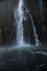 waterfall in milford sound new zealand