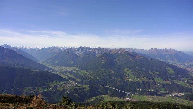 panning view over the start of the Brenner Pass in the alps with the road bridges of the main highway Brenner Autobahn A13 that connects Innsbruck in Austria to Italy. Taken from Patscherkofel