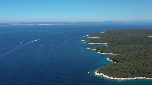 Beautiful Turquoise Coves and Seashore with amazing Beaches, Boats sailing on Blue Sea, Island of Rab in Croatia - Aerial Panoramic View