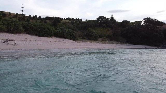 Droneshot Flying Backwards From The Beach To The Sea And Trees.mov