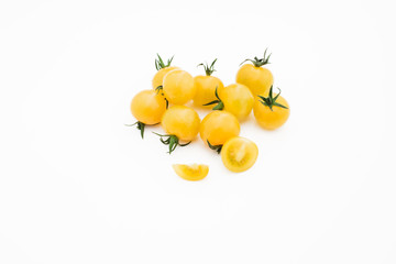 Closeup of yellow cherry on white background.
