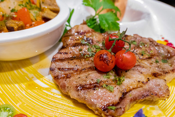 Pork steak on white dish