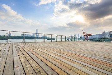 Fototapeta premium Empty plank square and city skyline with buildings in shanghai at sunset,China.