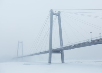 Bridge over the river in a fog