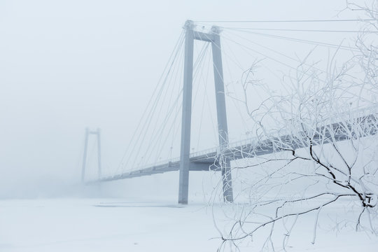 Bridge over the river in a fog