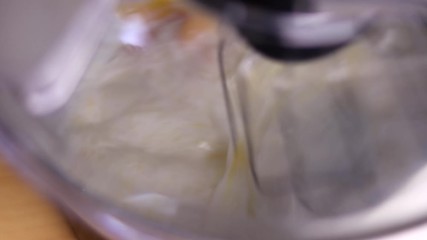 Close Up of egg and milk being mixed together in a mixer