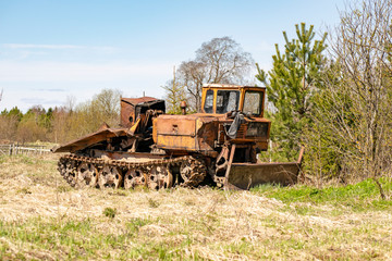 Skidder in the forest awaiting loading.