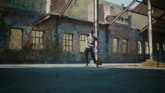 Man dancing in empty hall building