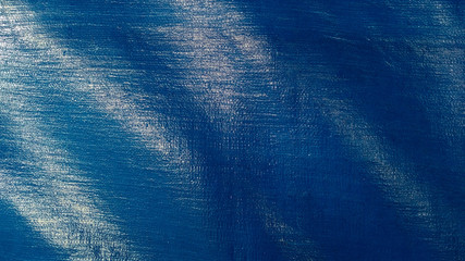 Shiny blue tarpaulin plastic texture
