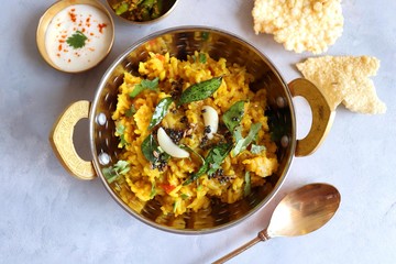 Dal khichadi/Masala Khichdi/daal khichdi tadka is a healthy Indian recipe made of mixed Lentils & rice combined with spices & vegetables. Served with Curd or Yogurt, Papad & chili pickle. Copy Space