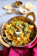 Dal khichadi/Masala Khichdi/daal khichdi tadka is a healthy Indian recipe made of mixed Lentils & rice combined with spices & vegetables. Served with Curd or Yogurt, Papad & chili pickle. Copy Space