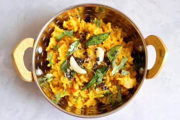 Dal khichadi/Masala Khichdi/daal khichdi tadka is a healthy Indian recipe made of mixed Lentils & rice combined with spices & vegetables. Served with Curd or Yogurt, Papad & chili pickle. Copy Space