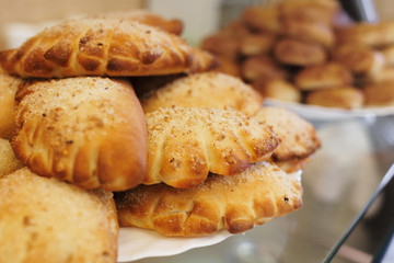 Homemade cake. Fresh rolls are on a platter. Close up. Top view
